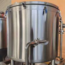 Stainless steel brewing tank with secure lid fittings.