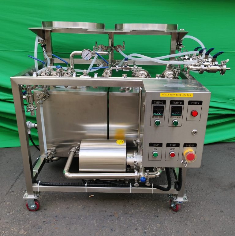 Stainless steel machine with control panel, pipes, and a motor for processing tasks.